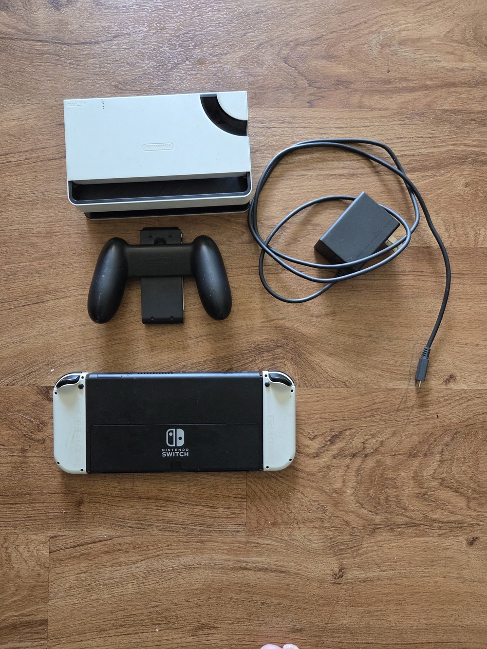 Nintendo Switch with White Joy‑Con Panels and Black Back